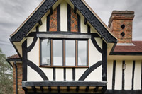 Clear glazed steel windows look beautiful in this Tudor style gable.